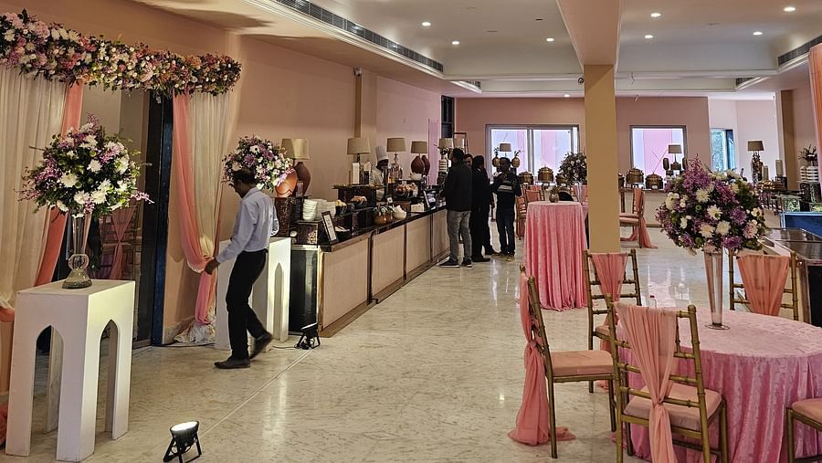 Image of elegantly arranged tables and chairs, ready to host a lavish banquet in the ballroom.